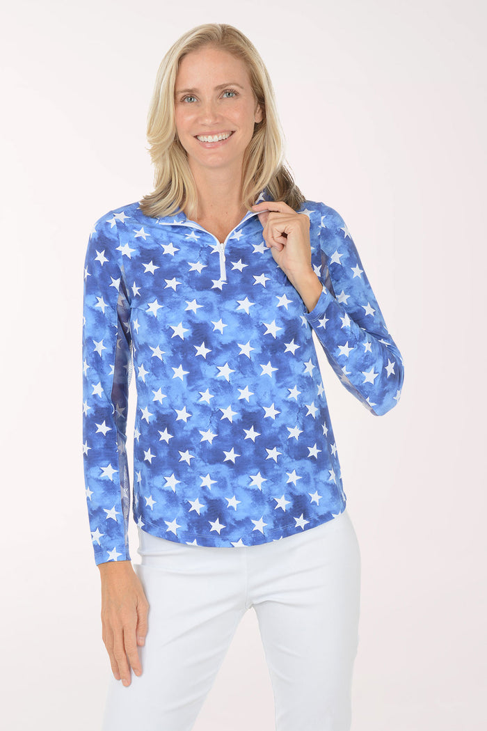 Woman wearing a blue star-patterned shirt on a white background