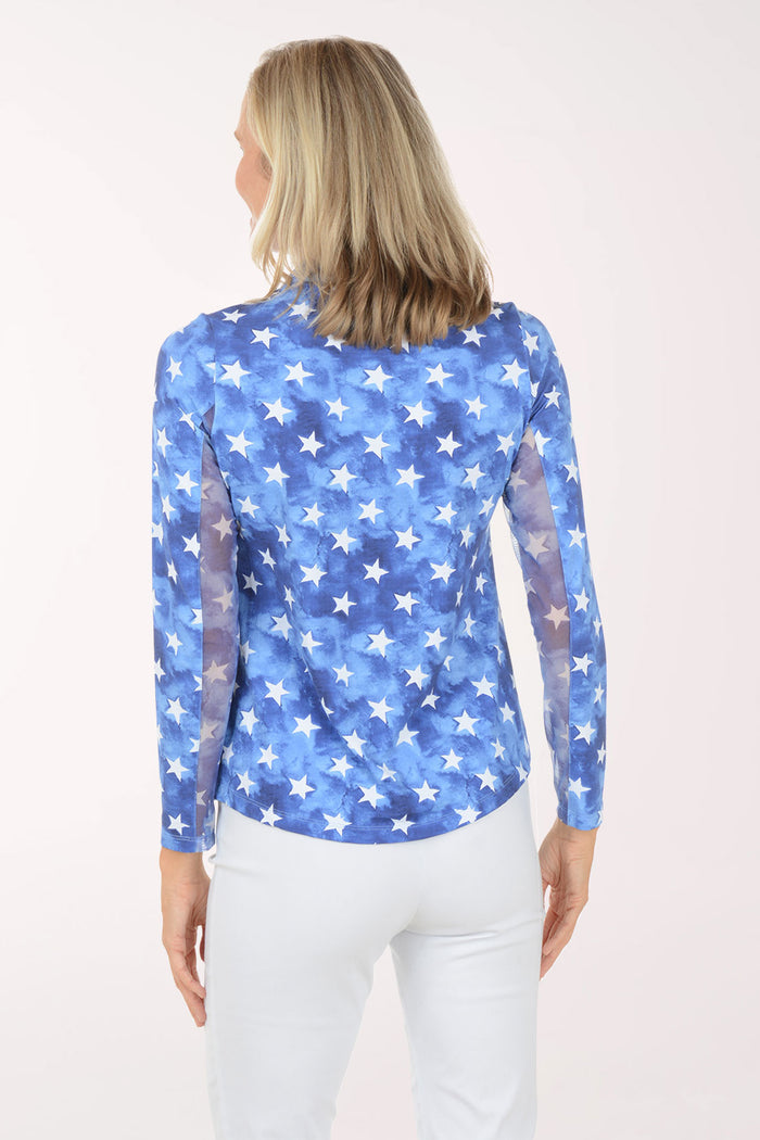 Woman wearing a blue star-patterned shirt on a white background
