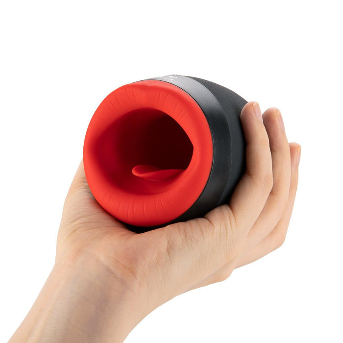 OTOUCH CHIVEN 2 compact oral masturbator held in hand showing portable size and red silicone interior