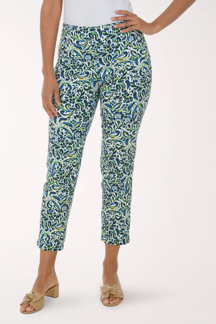 Woman wearing a patterned green and blue pants on a white background