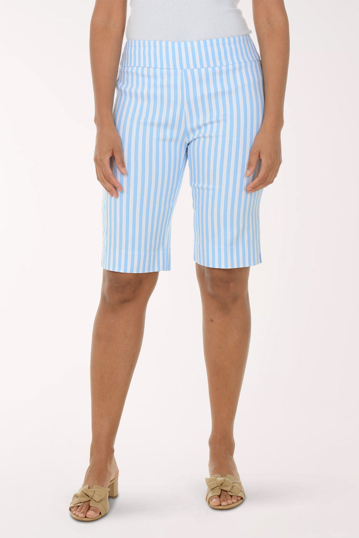 Person wearing light blue and white striped shorts on a white background