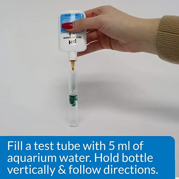White pH test solution bottle with blue label and red cap in PH Test Kit