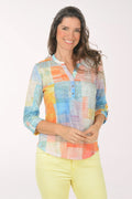 A woman wearing a multicolored plaid 3/4 sleeve top.